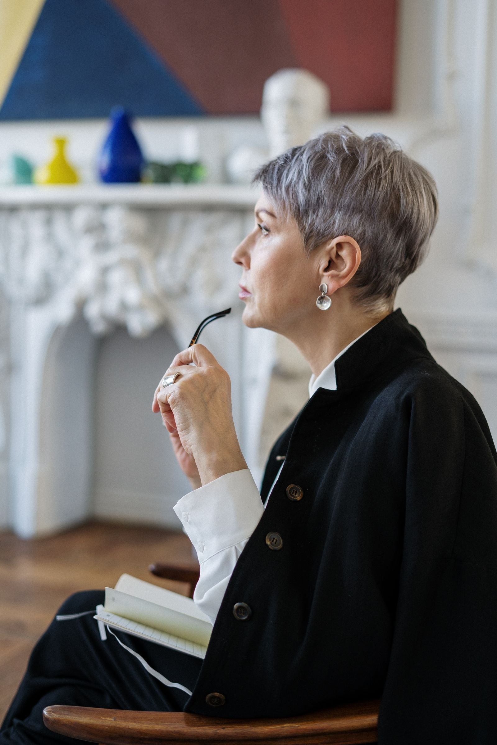 A property consultant considering options thoughtfully