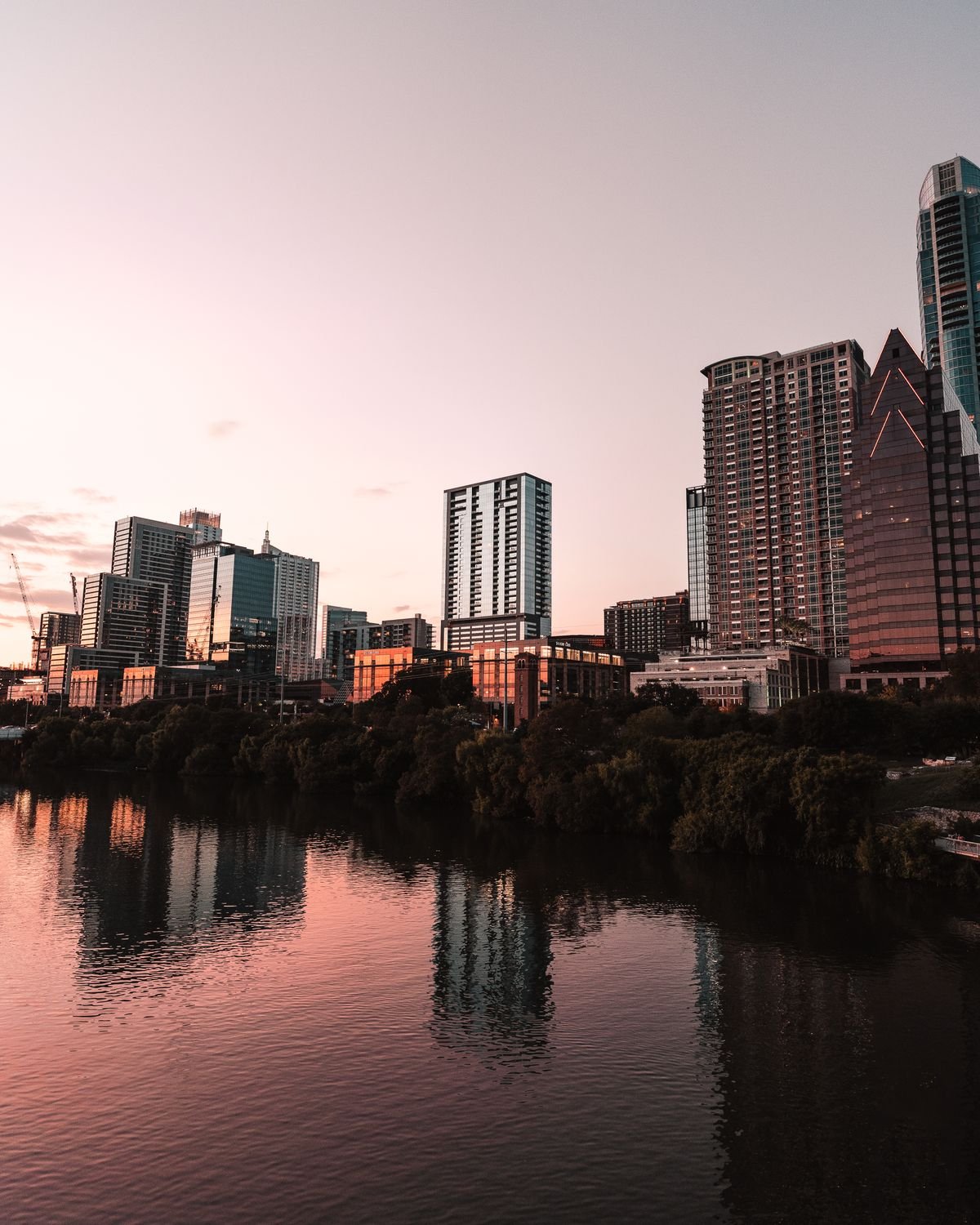 Austin, Texas skyline reflected in the Colorado River at dusk