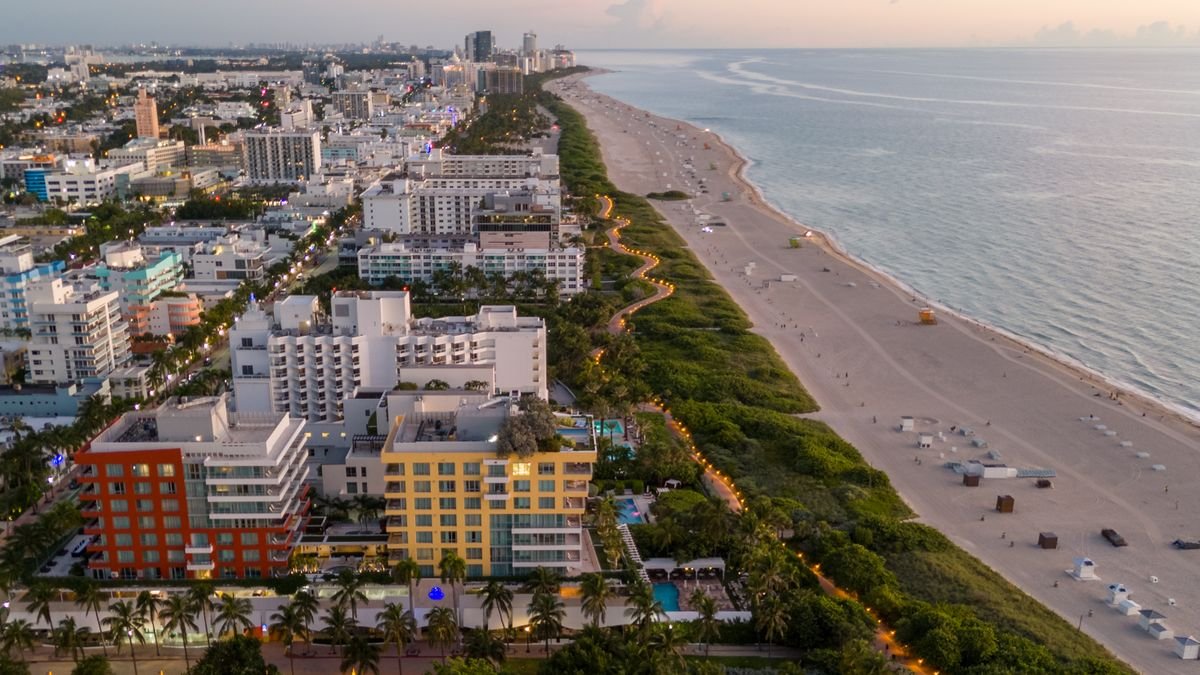 Aerial view of the Miami skyline and coastline at sunset