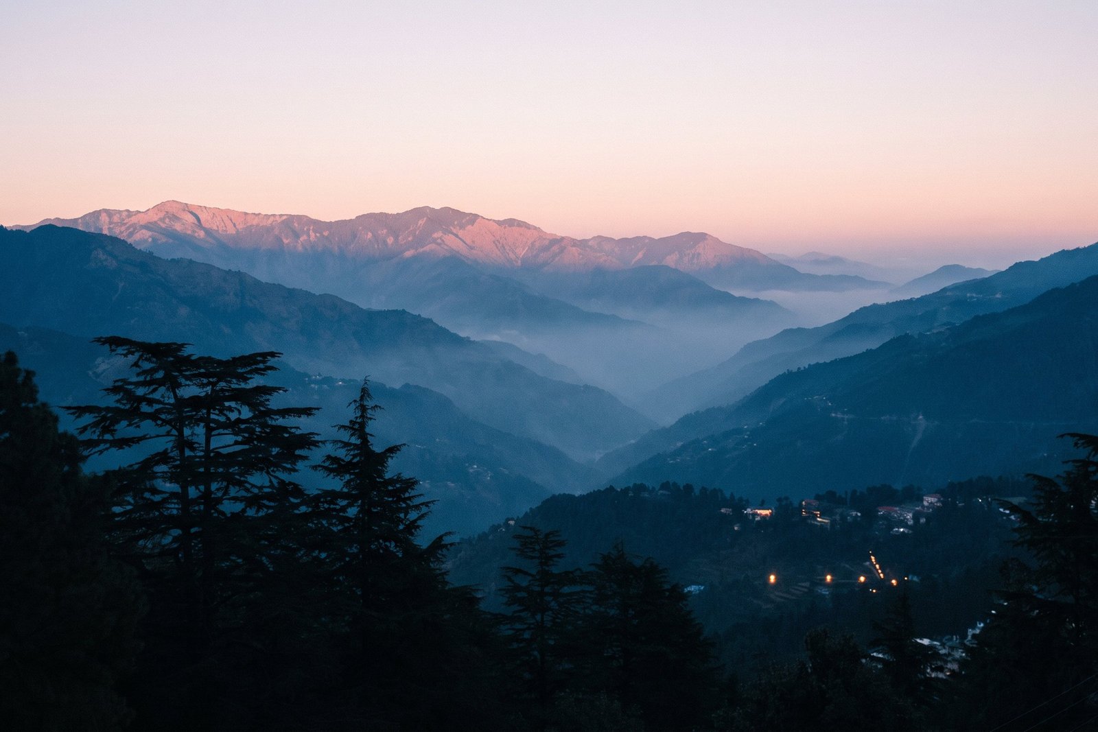 Last light on the ridge above Mussoorie, the Doon valley going dark and the lights of Dehradun coming on below