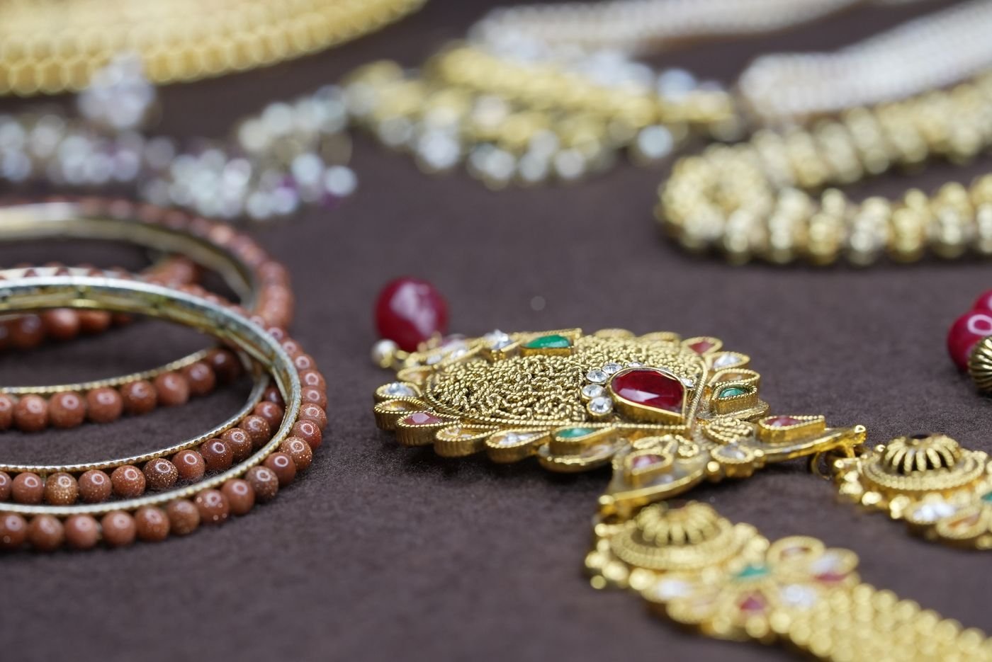 Fine gold jewellery display on showroom counter tray